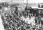View of soldiers marching out of Queens Drive from New Street and crossing over Hill Street and into John Bright Street during the First world War