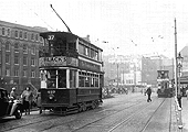 Looking along Hill Street towards the junction with Navigation Street whilst on the right beyond the tram stop is the entrance to Queens Drive