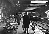 Looking East along Platform One in November 1965 whilst opposite Platform Three the erection of the new station continues apace