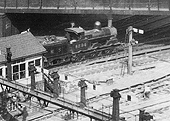 Close up showing the timber signal gantry adjacent to New Street No 5 Signal Box and the  signal controlling access to the tunnel