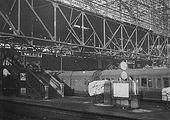 View of the travelling gantry in action over Platforms 4 and 5 deployed to assist in the safe demolition of Cowper's great roof