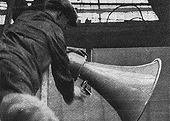 Workmen erecting one of New Street station's twenty-five loudspeakers deployed in October 1925 to improve station announcements