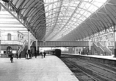 An early view of Platform 4 looking East with the entrance off Queens Drive to the left and with a MR train for Kings Norton standing in the platform