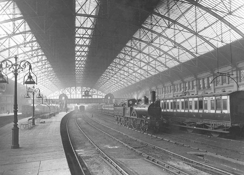 Looking towards the West end of the station along platform 2 as LNWR 2-2-2 'Small Bloomer' No 1816 'Vandal' stands on one of the centre roads