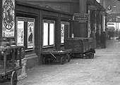 Close up of Platform 4 showing a variety of platform trollies used for carrying parcels, luggage and on the extreme left, for carriage oil lamps