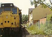 An unidentified Brush Type 2 A1A+A1A diesel locomotive pauses at the site of the abandoned Birdingbury station