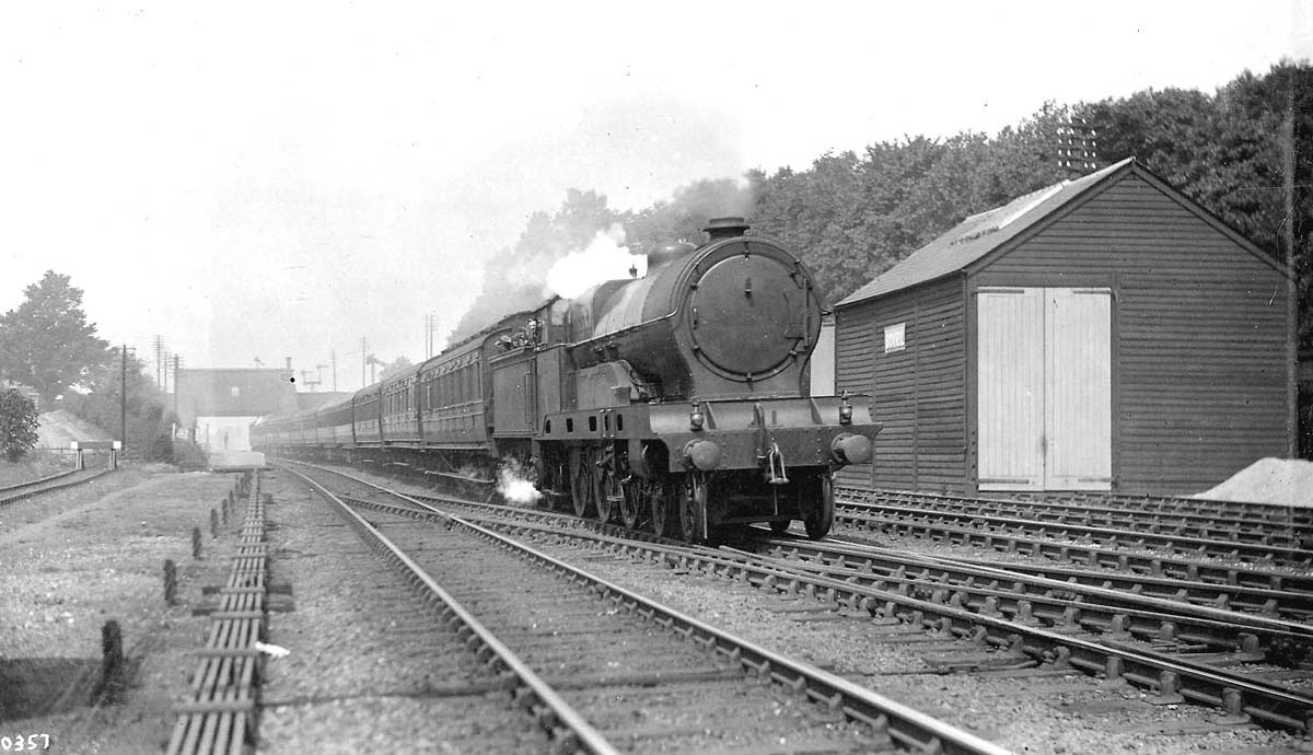 Ex-LNWR 4-6-0 'Claughton' class No 6004 'Princess Louise' passes Brinklow goods shed on an up express circa late 1920s