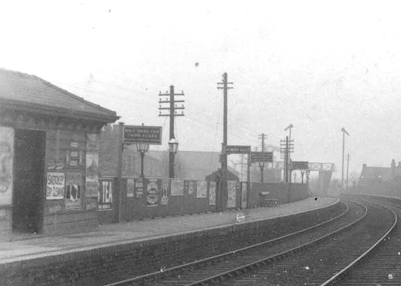 Close up showing Chester Road station's up platform and the basic waiting room together with the station signage