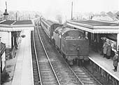 Ex-LMS 4P 2-6-4T No 42330 is seen running bunker first as it arrives at Chilvers Coton station with the 6:56pm Coventry to Nuneaton service
