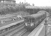 A two-car Birmingham RC&W DMU is seen arriving at Chilvers Coton station on the 5:28pm Leamington to Nuneaton service