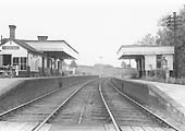Looking towards Rugby with the signal cabin and main station buildings on the up platform on the right