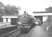 Ex-MR 4-4-0 Class 483 No 408 stands at Clifton Mill station in mid-1930s whilst the driver appears to filling his billycan with water