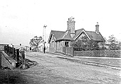 Looking towards Birmingham this late Victorian view of the station master's house shows the level crossing closed to road traffic