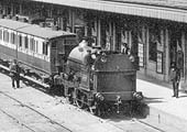 Close up showing LNWR Sharp 2-2-2ST No 1929 at the head of a local train standing at the up platform