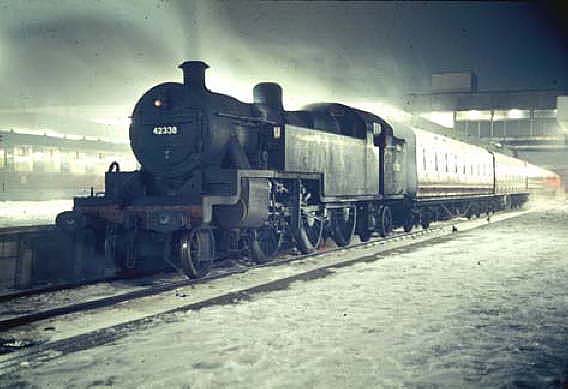 Ex-LMS 2-6-4T 4MT No 42338 is seen standing at Coventry station's new platform three on a Rugby to Birmingham local passenger train