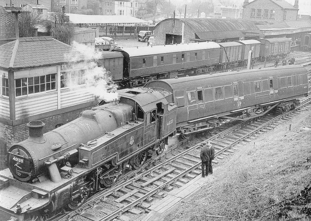Ex-LMS 3MT 2-6-2T No 40135 is seen with a derailed 57 ft ex-LMS brake adjacent to Coventry No 2 Signal box on 21st November 1959