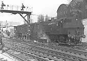 British Railways built Ivatt 2-6-2T No 41285 is seen shunting rolling stock in the new parcels depot approach which lay behind the up platform