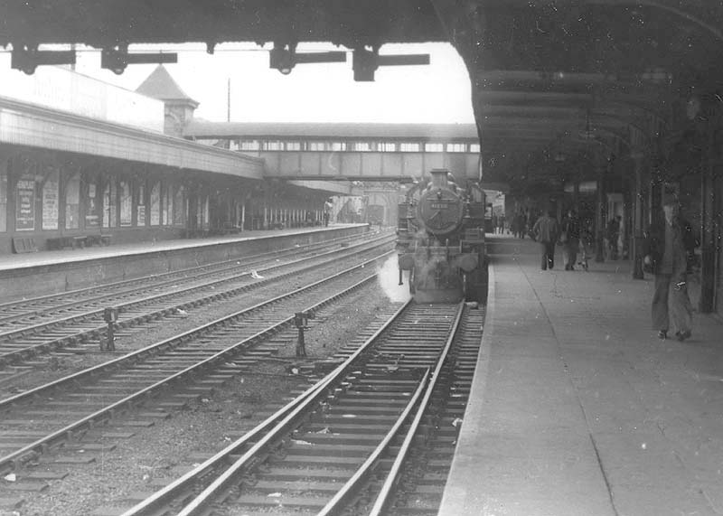 British Railways built Ivatt 2MT 2-6-2T No 41266 is seen at the head of a local passenger service to Rugby