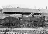 Ex-LMS 2-8-0 8F No 48755 is see at the head of an up goods train as it passes Warwick Road goods yard