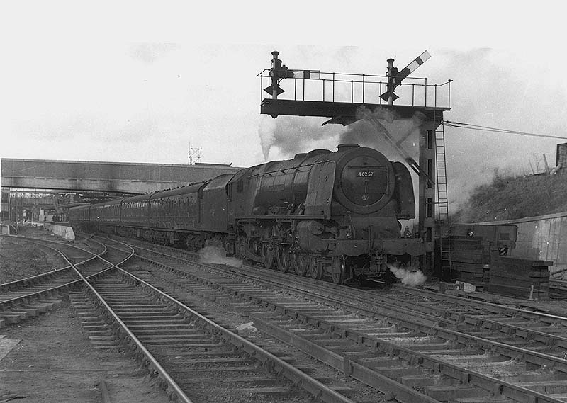 Ex-LMS 4-6-2 8P Coronation Scot class No 46257 'City of Salford' is seen at the head of an up Birmingham to Euston express service