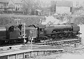 Ex-LMS 4-6-2 8P Coronation class No 46241 'City of Edinburgh' is seen standing at platform one on an up express waiting for the right of way