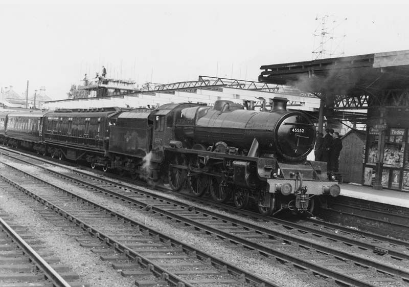 Ex-LMS 4-6-0 Jubilee class No 45552 'Silver Jubilee' is seen arriving at platform one with the Royal Train on a visit by the Queen to the Coventry