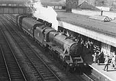 Ex-LMS 4-6-0 Black 5 No 44815 on an up semi-fast express pulls into the up platform on a sunny day in the late 1950s