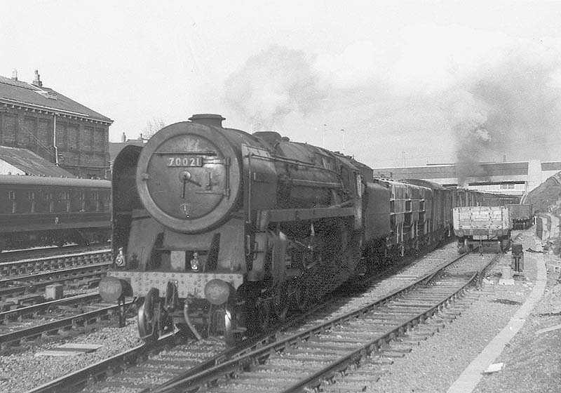 BR 4-6-2 7MT Standard Britannia class No 70021 'Morning Star' is seen at the head of a down cement train passing opposite Coventry No 1 Goods shed