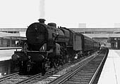 Ex-LMS 2-6-0 'Crab' No 42940 is seen standing at Coventry station's platform three at the head of a Rugby to Birmingham service