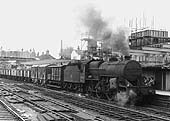 Ex-LMS 2-6-0 'Hughes Crab' No 42783 is seen at the head of an up freight service as it passes by platform one during the station's reconstruction