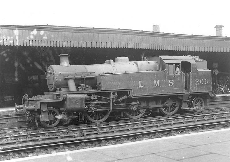 Ex-LMS 2-6-2T 3MT No 206 is seen light engine standing at platform after shunting brake vans in the parcels bay