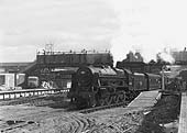 Ex-LMS 4-6-0 rebuilt Royal Scot class No 46164 'The Artists Rifleman' stands with a down Euston to Birmingham express during reconstruction