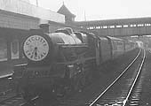 An unknown ex-LMS 4-6-0 Jubilee class locomotive is seen at the head of a cyclists special train running wrong road through Coventry station