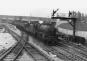 Ex-LMS 4-6-0 Black 5 No 45495 is seen on an up empty oil train passing by the half-built new platform two on its way south to the docks