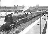 Ex-LMS 4-6-2 Coronation class No 46245 'City of London' stands at platform 3 on a down service in 1964