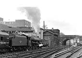 Ex-LMS 4-6-0 5XP 'Jubilee Class No 45686 'St Vincent' stands at the down platform with an express for Wolverhampton