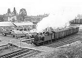 View of ex-LMS 2P 0-4-4T No 41900 is seen running wrong road with a parcels train having just left the new depot