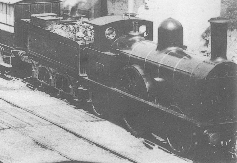 Close up view showing LNWR Class 7'-0 2-2-2 'Bloomer' No 251 'Apollo' standing at Coventry station taking on water