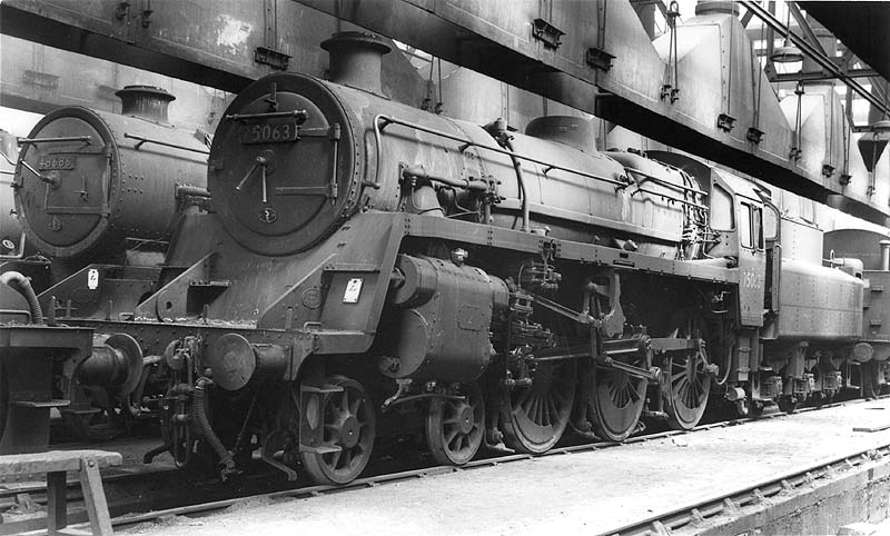 British Railways 4-6-0 Standard class 5MT No 75063 is seen standing in front of ex-LMS 8F No 48686 inside Coventry's new shed