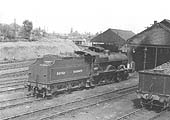 Ex-LMS 4P Compound 4-4-0 No 41122 receives attention to its outside cylinders outside Coventry shed