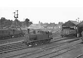 Ex-LMS Fowler 2-6-2T No 40002 is seen on shed in company with another LMS design and in the background a LNWR goods engine