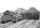 BR built 2MT 2-6-2T No 41236 stands outside the original shed next to an unidentified ex-LMS 0-6-0 4F locomotive