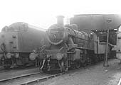 Ex-LMS 2-6-0 2MT No 46420 is seen standing in front of an unidentified ex-LNWR 0-8-0 'Super D' and an unidentified ex-LMS 2-8-0 8F locomotive
