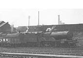 Close up showing LMS 4P Compound 4-4-0 No 1172 standing next to an unidentified ex-LNWR 0-8-0 G2 class locomotive