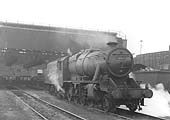Ex-LMS 2-8-0 8F No 48616 is seen carrying a 18A Toton shed plate as it comes off Coventry shed having been coaled and watered
