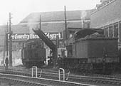 Close up showing an ex-LMS 2MT 2-6-0 locomotive being coaled by Coventry's new conveyor belt