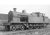 Ex-LNWR 4P 4-6-2T No 6980 stands fully coaled and watered on 12th May 1934 in front of Quinton Road fence
