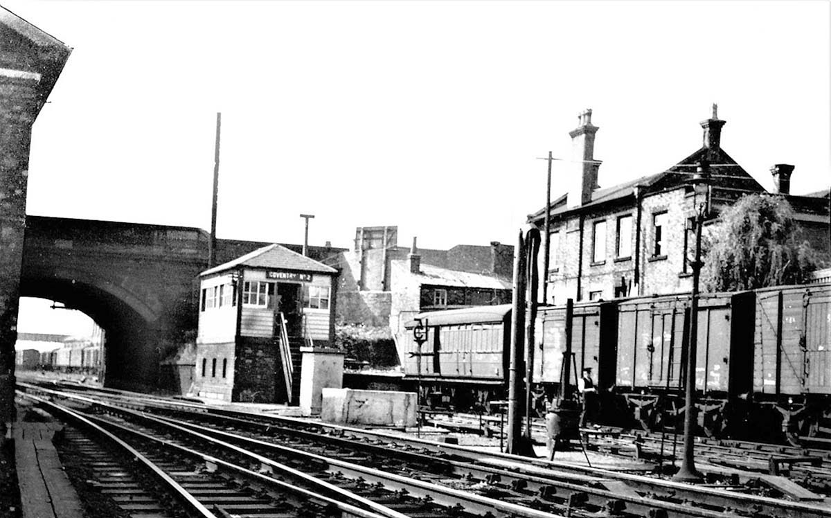 Looking towards Coventry Signal box No 2 with the parcels depot on the right and 15mph sign and the water column