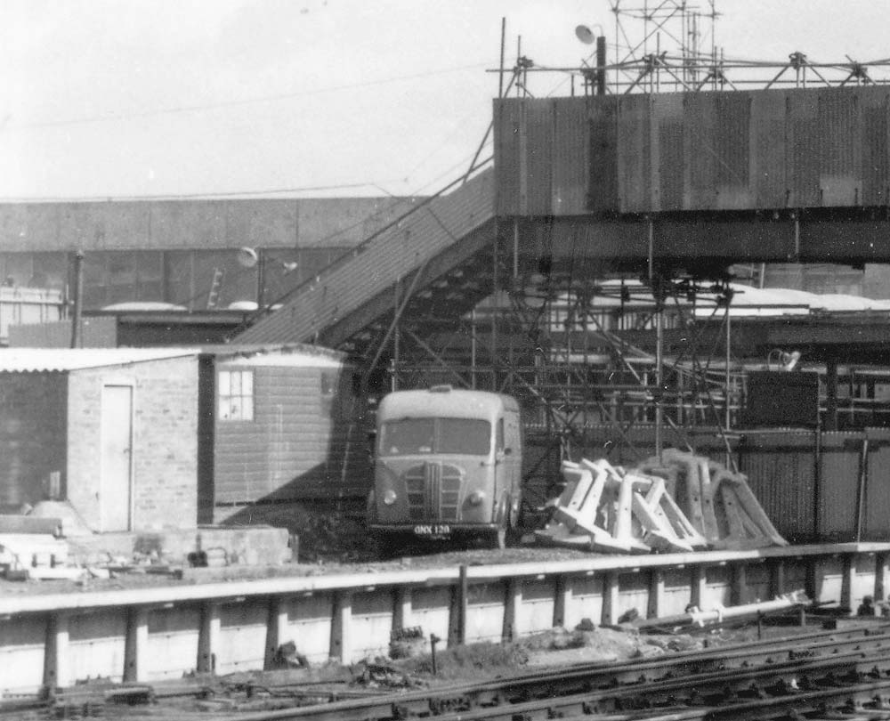 Close up showing the up platform side of the temporary footbridge and the contractor's site huts occupying the Birmingham end of platform one