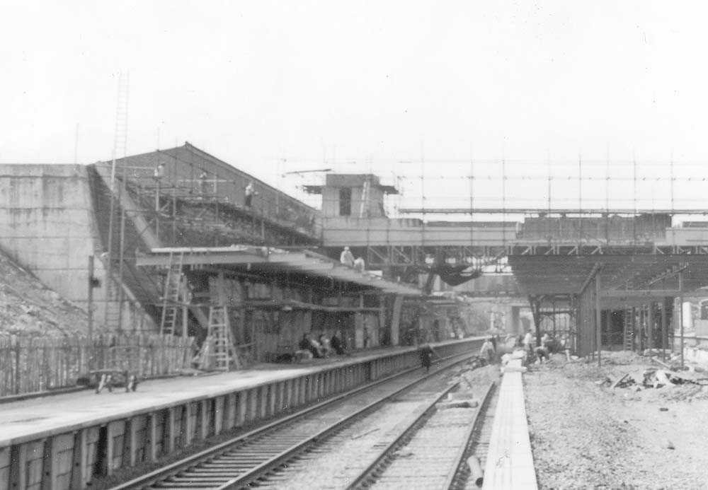 Close up showing the southern end of the passenger facilities on platform 4 and the retaining wall behind
